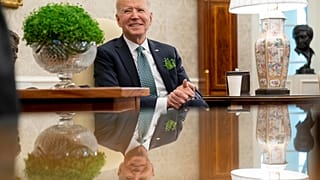 President Joe Biden speaks during a virtual meeting with Ireland's Prime Minister Micheal Martin on St. Patrick's Day, in the Oval Office of the White House.