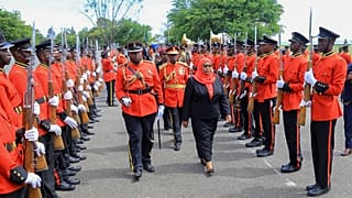 Tanzania's new president Samia Suluhu Hassan inspects the guard of honor