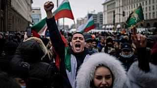 Retailers and owners of cafes, bars and restaurants and their staff shout slogans and wave flags as they attend a protest against COVID-19 restrictions 