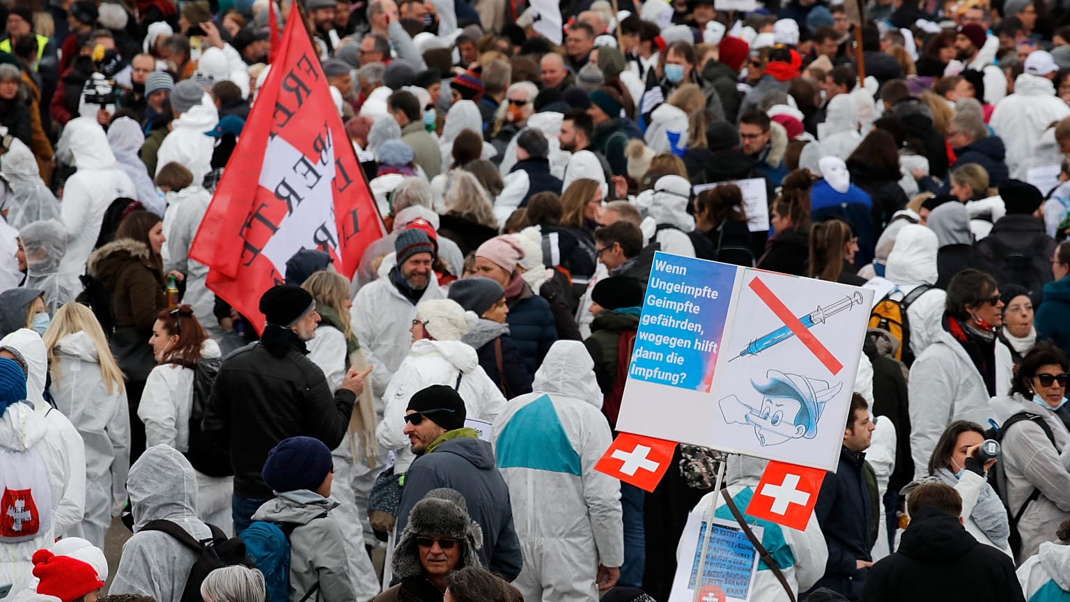 Protesters take part in a demonstration against the ongoing coronavirus Covid-19 restrictions in Liestal, near Basel, Switzerland, on March 20, 2021. 