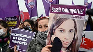 A protester holds a picture of a woman killed by a man at a demonstration against Turkey's withdrawal from the Istanbul Convention,  in Istanbul, on March 20, 2021. 