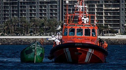 Spanish coastguards arrive in Arguineguin carrying migrants after their rescue in Gran Canaria island, Spain on Wednesday Nov. 25, 2020. 