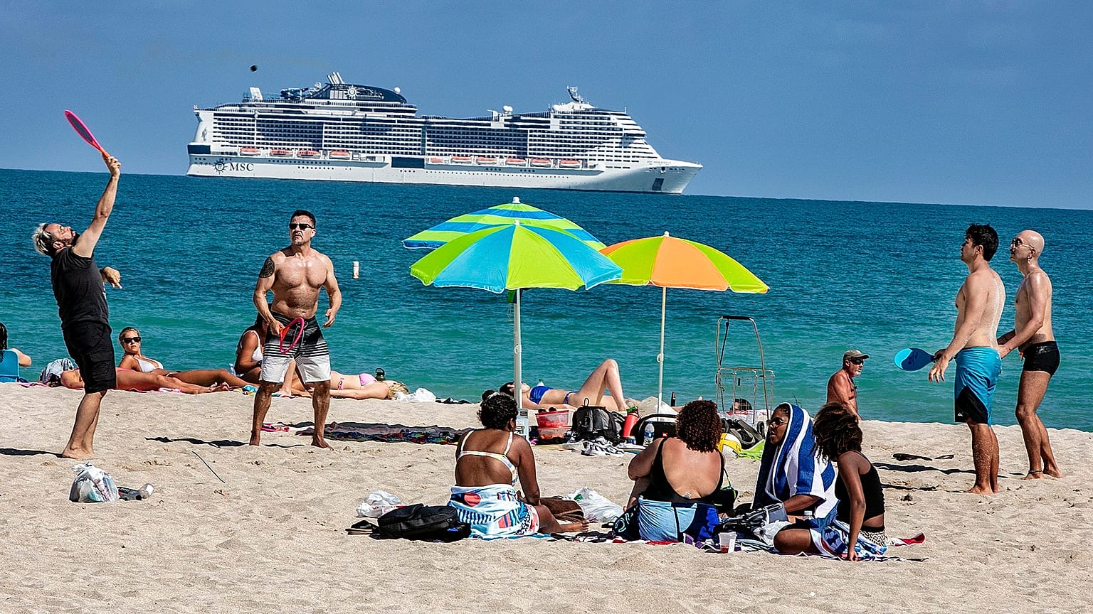 Beach goers enjoy the beautiful weather at the beach, Wednesday, March 2, 2021 in Miami Beach