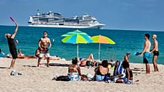 Beach goers enjoy the beautiful weather at the beach, Wednesday, March 2, 2021 in Miami Beach