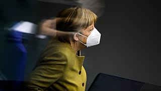 FILE: Chancellor Angela Merkel attends a debate of the German Parliament Bundestag about the coronavirus outbreak situation in Berlin, Germany, Thursday, March 4, 2021.
