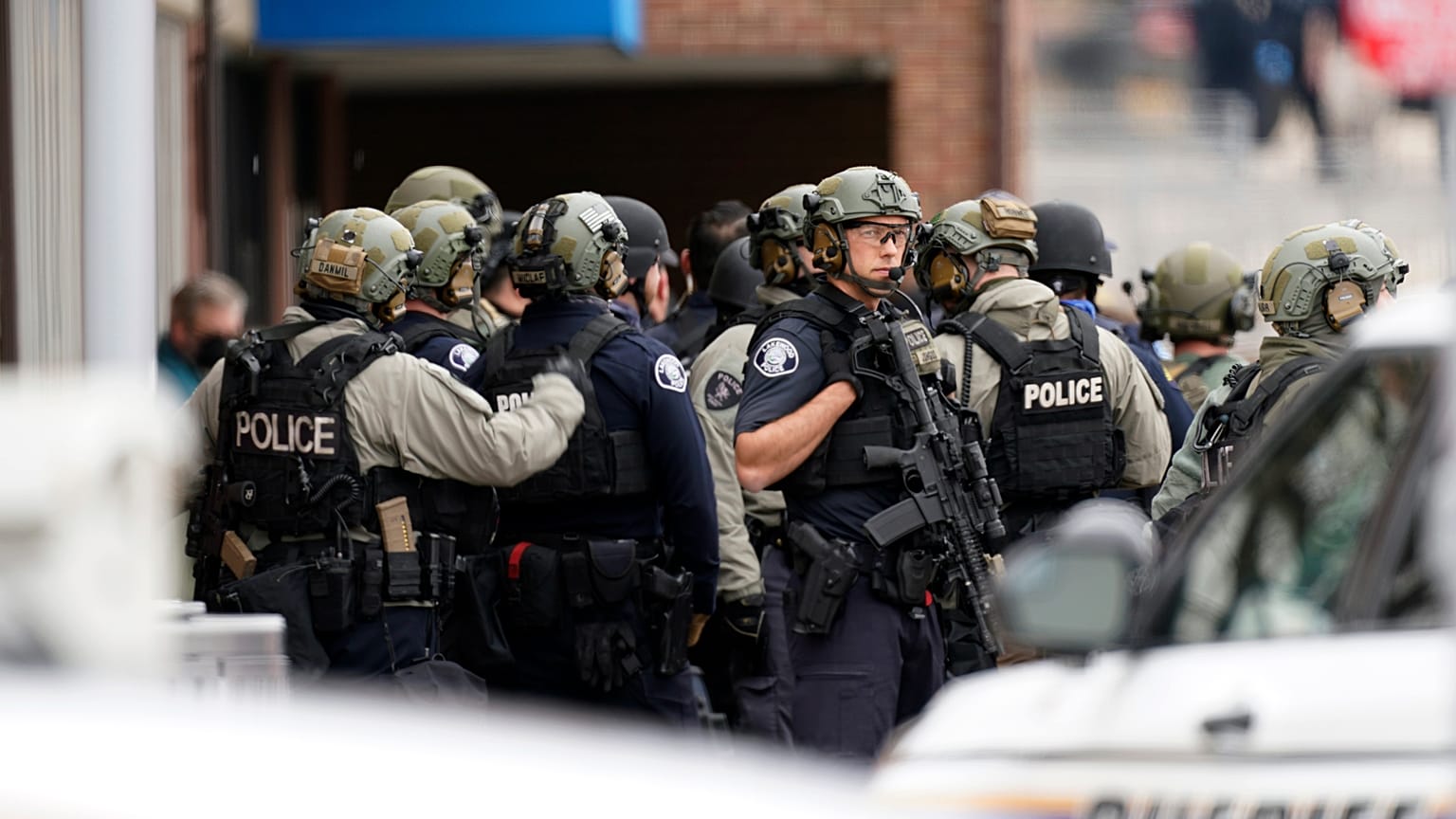 Police stand outside King Soopers grocery store after a mass shooting, Monday, March 22, 2021, Boulder, Colorado, United States