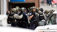 Police stand outside King Soopers grocery store after a mass shooting, Monday, March 22, 2021, Boulder, Colorado, United States