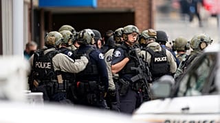 Police stand outside King Soopers grocery store after a mass shooting, Monday, March 22, 2021, Boulder, Colorado, United States