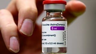 Medical staff prepares an AstraZeneca coronavirus vaccine during preparations at the vaccine center in Ebersberg near Munich, Germany, Monday, March 22, 2021.