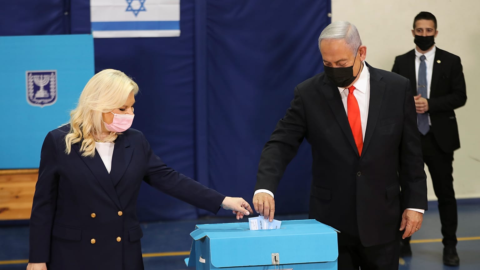 Israeli Prime Minister Benjamin Netanyahu and his wife Sara cast their ballots at a polling station as Israelis vote in a general election, in Jerusalem. March 23, 2021