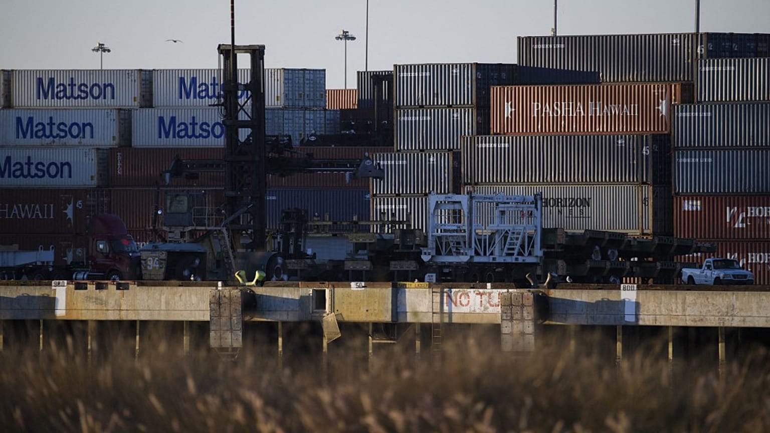 Cargo shipping containers are seen in the Port of Long Beach, California.