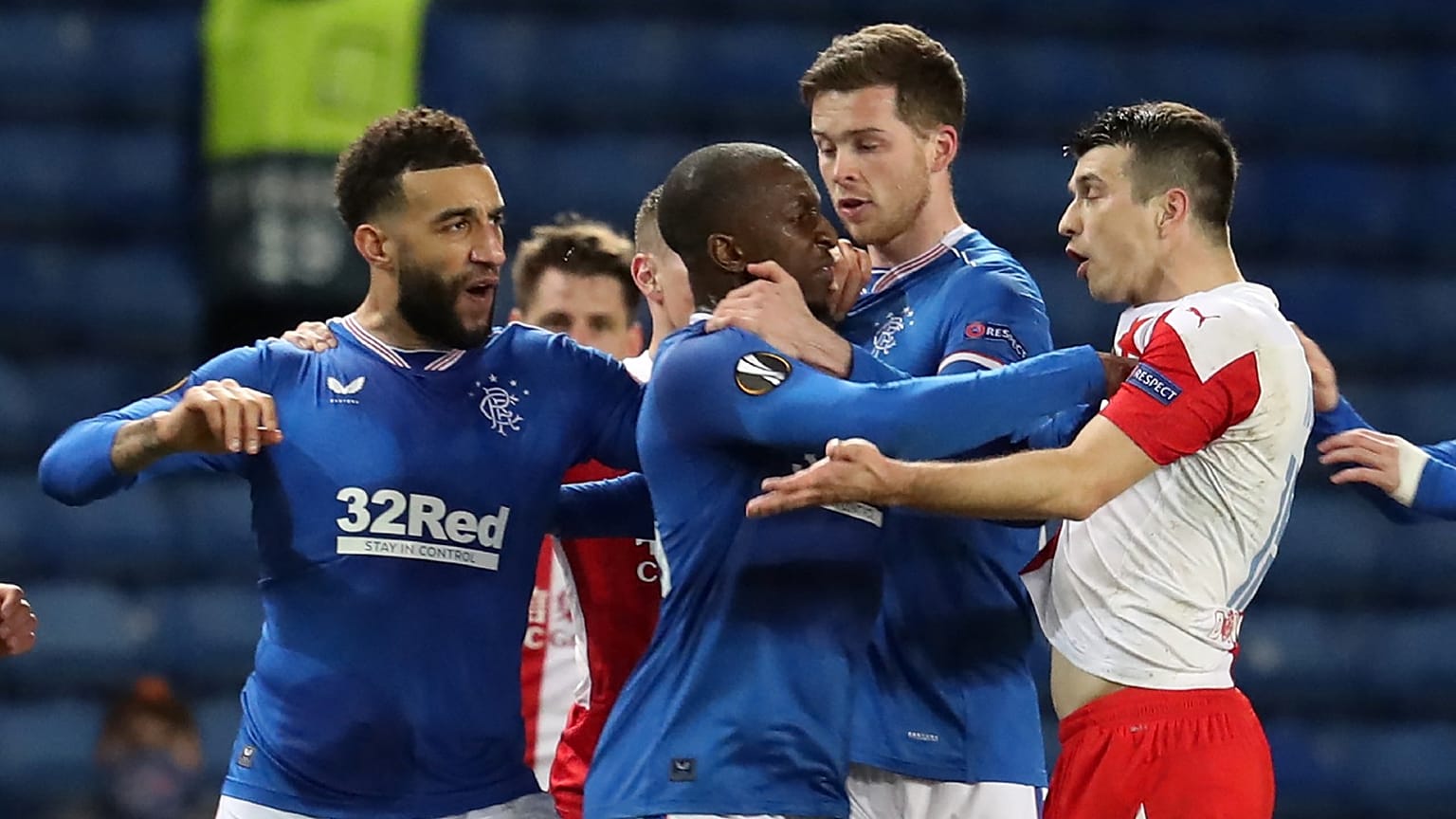 Rangers' Finnish midfielder Glen Kamara (C) and Slavia Prague's Czech defender Ondrej Kudela (R) clash 