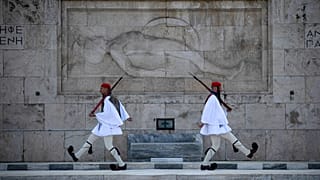 Presidential Guards perform a shift change at the Tomb of the Unknown Soldier, in Athens