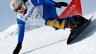 France's Julie Pomagalski speeds down the Parallel Giant Slalom at the FIS Snowboard World Championship in Arosa, Switzerland on Jan. 16, 2007.
