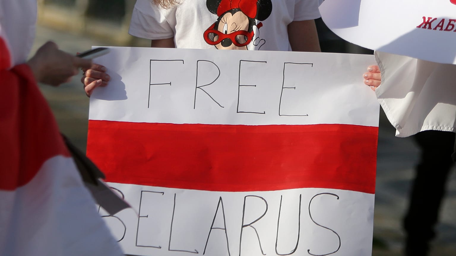 Demonstrators hold posters during a protest demanding freedom for Belarusian political prisoners in Lisbon, Portugal, on March 6, 2021.