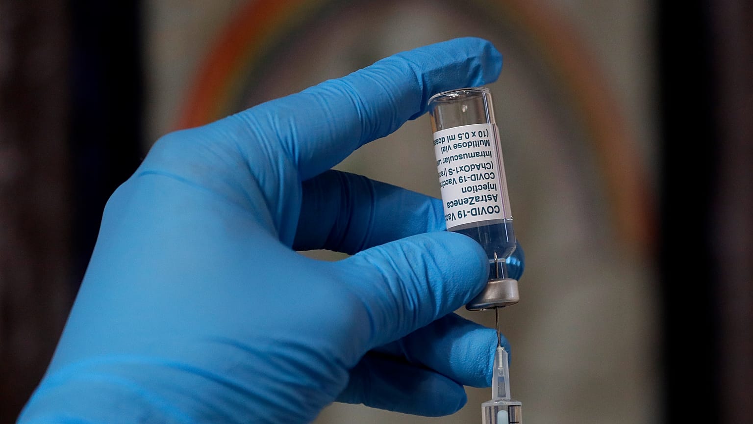 A syringe of the AstraZeneca vaccine is prepared in Ealing, London.
