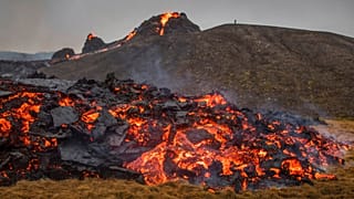 Lava flows from an eruption of a volcano on the Reykjanes Peninsula in southwestern Iceland on Saturday, March 20, 2021