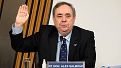 Former Scottish leader Alex Salmond is sworn in before giving evidence to a committee of the Scottish parliament at Holyrood in Edinburgh, Friday Feb. 26, 2021.