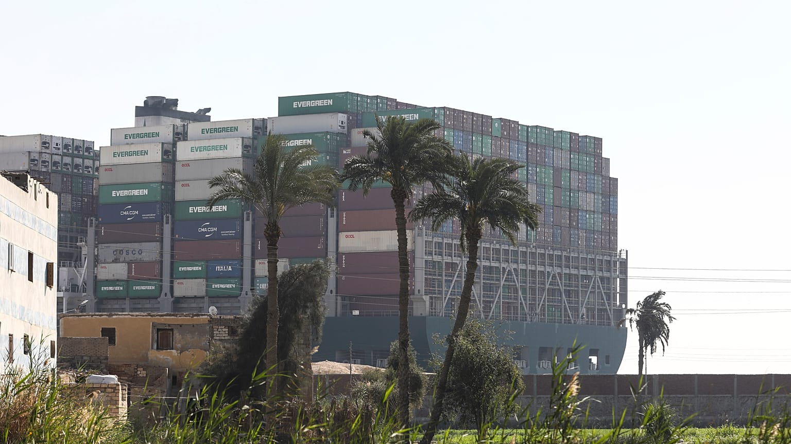 Ever Given, a Panama-flagged cargo ship, that is wedged across the Suez Canal and blocking traffic in the vital waterway is seen Saturday, March 27, 2021.