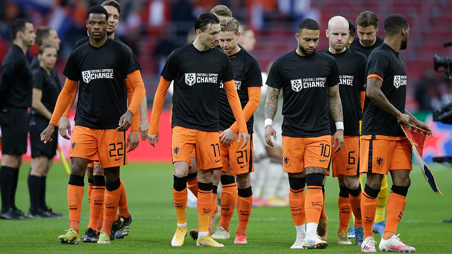 Netherlands' players enters on the field with shirts reading 'Football Supports Change' prior to the start of the World Cup 2022 qualifier vs Latvia on March 27, 2021.