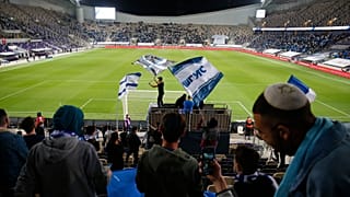 Israeli fans cheer before the World Cup 2022 group F qualifying soccer match between Israel and Denmark in Tel Aviv