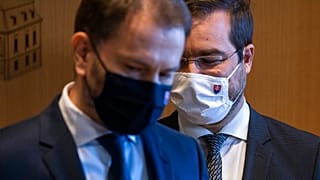 Slovakia's Prime Minister Igor Matovic, left, with Health Minister Marek Krajci at Presidential palace in Bratislava, Friday, March 12, 2021.