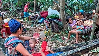 Karen villagers gather in the forests as they hide from military airstrikes in the Deh Bu Noh area of the Papun district, north Karen state, Myanmar, Sunday, March 28, 2021.