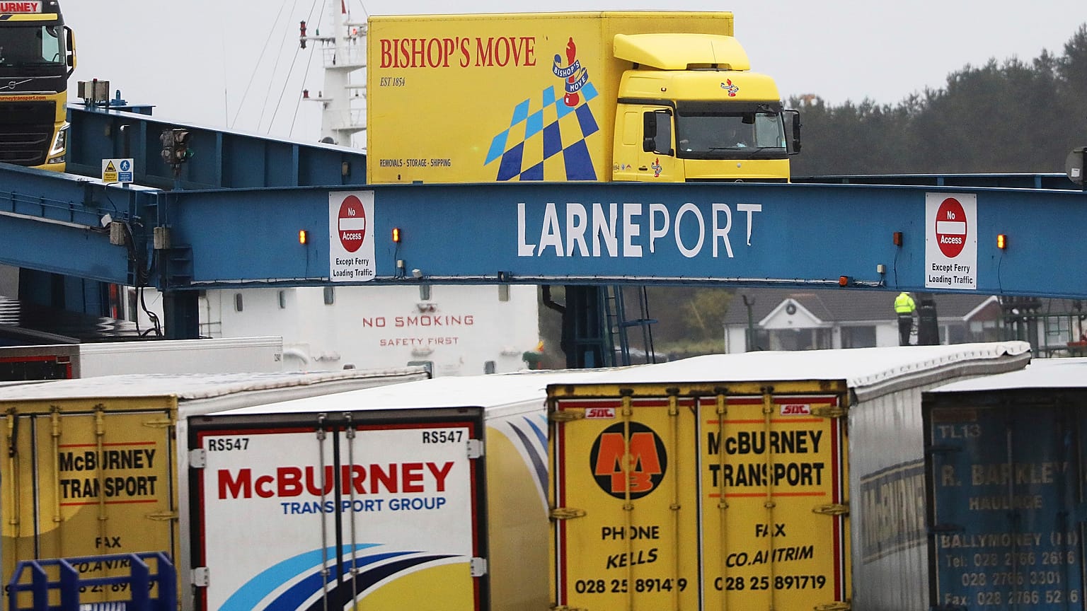 vehicles disembark from a ferry arriving from Scotland at the port of Larne, Northern Ireland Feb. 2, 2021.