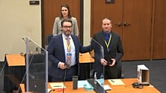 Derek Chauvin (R) with his defense attorney Eric Nelson (L) introduce themselves to potential jurors on March 23, 2021 at the Hennepin County Courthouse in Minneapolis.