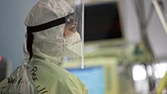 A nurse looks at a monitor in the COVID Intensive Care Unit of the San Filippo Neri hospital in Rome, Friday, March 19, 2021.
