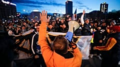 Protestors shouted slogans outside the Romanian government headquarters in Bucharest.