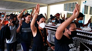 Three finger salutes at Myanmar funerals