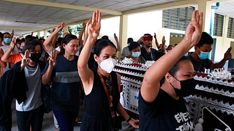 Three finger salutes at Myanmar funerals