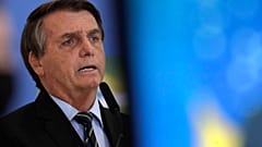 Brazil's President Jair Bolsonaro speaks at a ceremony announcing economic measures to support philanthropic hospitals and help them treat COVID-19 patients.