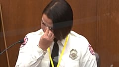 In this image from video, Minneapolis Firefighter Genevieve Hansen, wipes her eyes as she testifies on March 30, 2021.