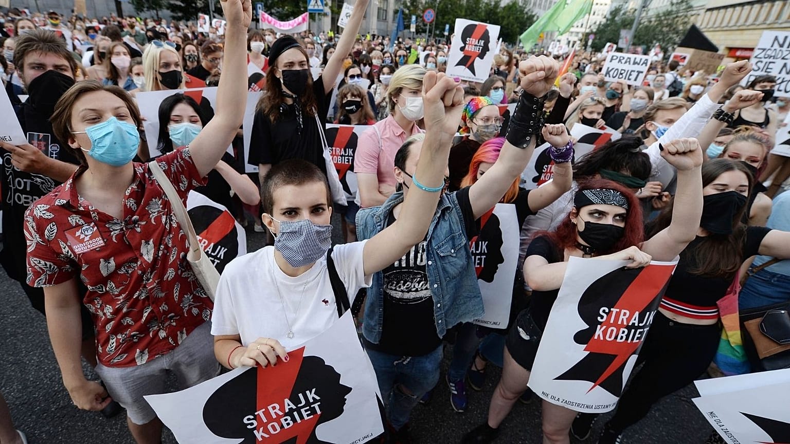 Protesters with a banner reading "Women's Strike" in a rally against Polish government