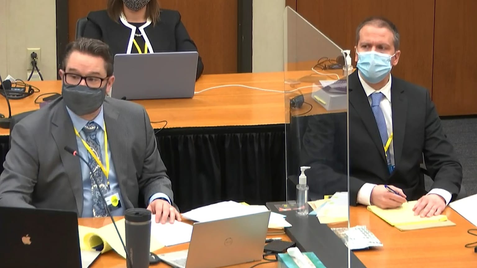 Defence attorney Eric Nelson, left, and defendant former Minneapolis police Officer Derek Chauvin listen in court. March 31, 2021.