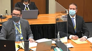 Defence attorney Eric Nelson, left, and defendant former Minneapolis police Officer Derek Chauvin listen in court. March 31, 2021.