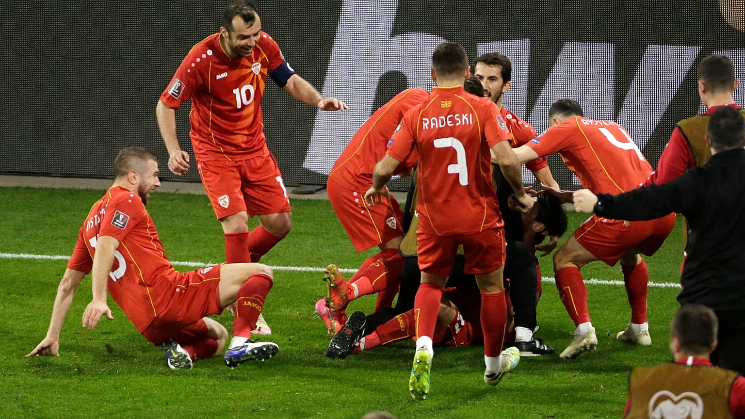 North Macedonia's Eljif Elmas, not seen in the frame, celebrates with his teammates after scoring his side's second goal during the group J qualifying game agaist Germany