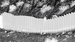 Smugglers drop children over US border barrier