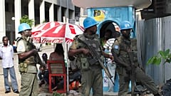 FILE: UN forces stand guard on a street in Abidjan, Ivory Coast, Dec. 22, 2010.