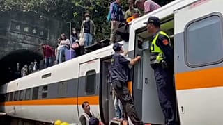 Survivors led away from Taiwan train crash as dead toll rises