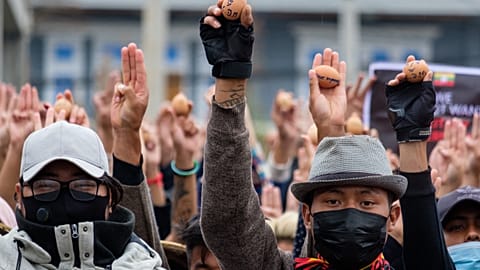 Protesters holding eggs to coincide with Easter Sunday during a demonstration against the military coup in Myanmar