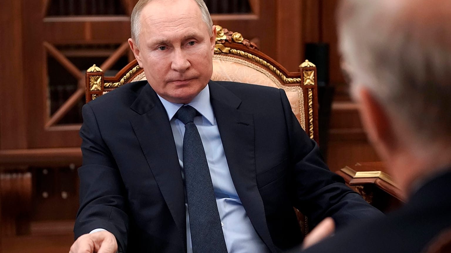 Russian President Vladimir Putin listens to General Director of the Russian Direct Investment Fund Krill Dmitriev at the Kremlin in Moscow, Russia, Friday, April 2, 2021. 