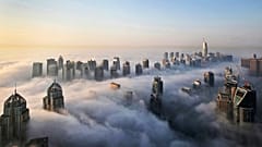 In Oct. 5, 2015 file photo, a thick blanket of early morning fog partially shrouds the skyscrapers of the Marina and Jumeirah Lake Towers districts of Dubai.