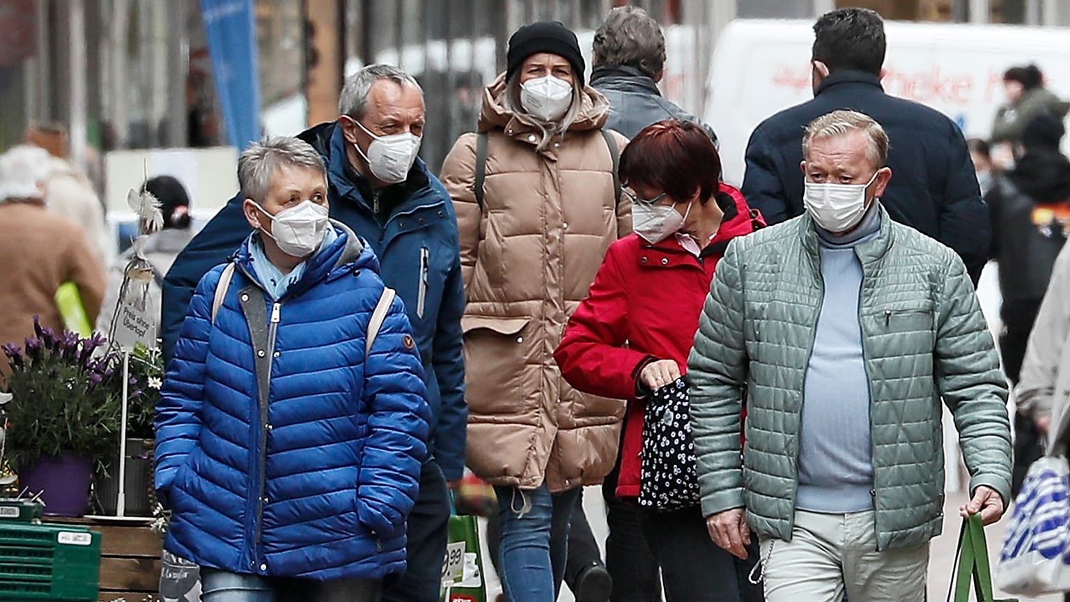 People wear face masks at a shopping street in Gelsenkirchen, Germany, Tuesday, April 6, 2021.
