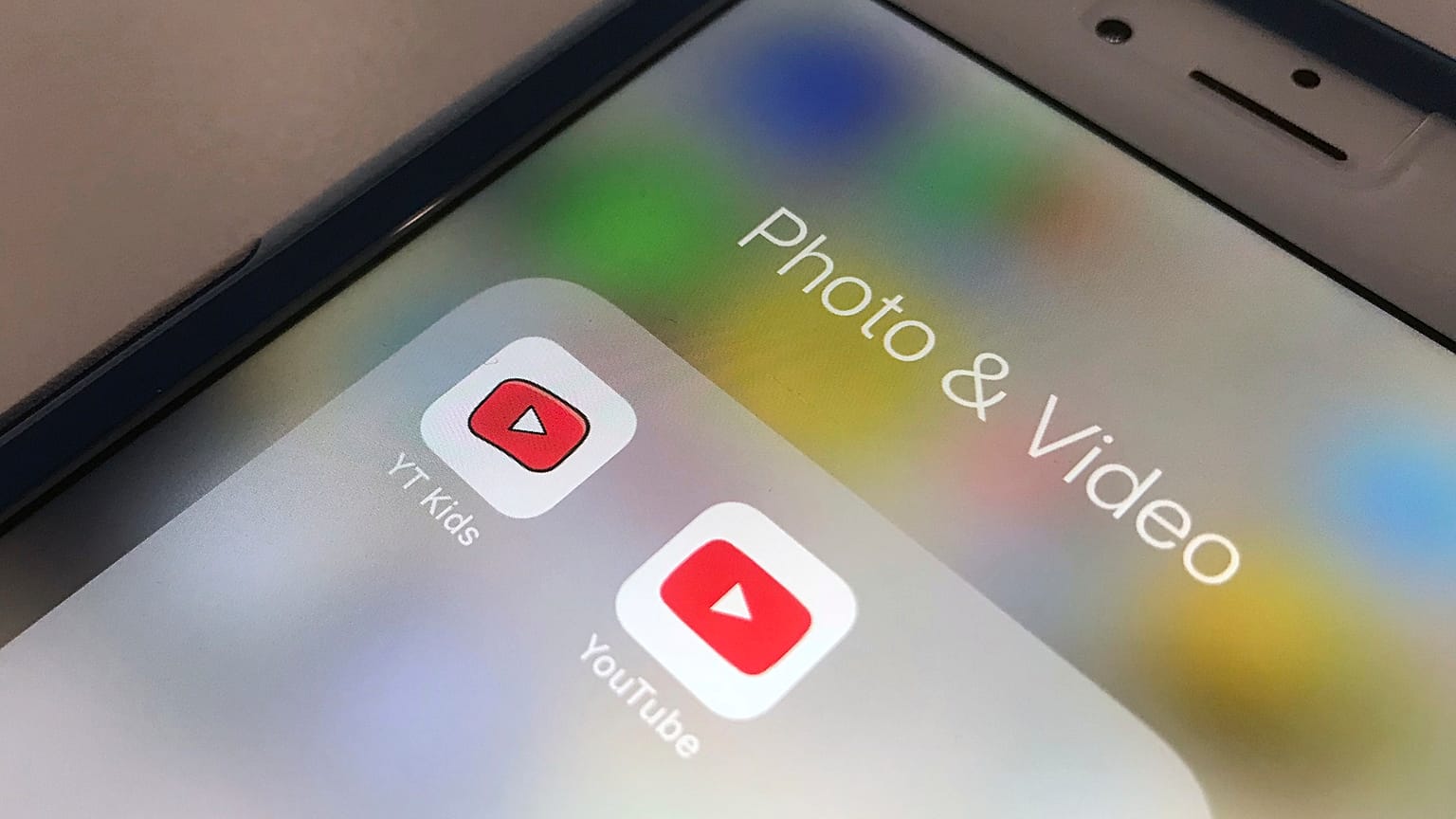 The YouTube app and YouTube Kids app are displayed on an iPhone in New York.