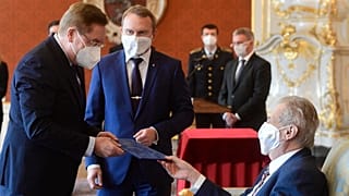 Czech president Milos Zeman, right, appoints Petr Arenberger, left, director of the Prague-Vinohrady Teaching Hospital, as the new Czech health minister