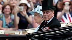Britain's Queen Elizabeth II and Prince Philip, the Duke of Edinburgh return to Buckingham Palace in a carriage, in London, June 17, 2017.