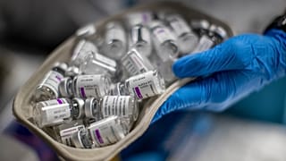 A nurse holds vials of AstraZeneca vaccine against COVID-19 during a vaccination campaign at WiZink indoor arena in Madrid, Spain, April 9, 2021.